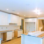 Kitchen,In,Progress,With,White,Cabinets,,Bare,Countertops,,Scattered,Tools